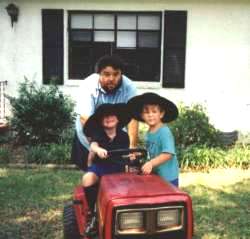 Dad and boys on mower 8/98