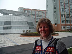 Carol Outside by the futuramic Conference Center At the Gold Apple Bilingual School in Shanghai China