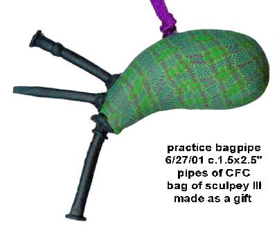 Single drone bagpipe with plaid (PLAID!!) bag.